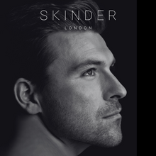 Load image into Gallery viewer, a black and white image of a man with clear, hydrated, smooth, even skin. the SKINDER LONDON logo is at the top of the screen. this image shows hybrid multi use skincare and beauty for men. @skinderofficial