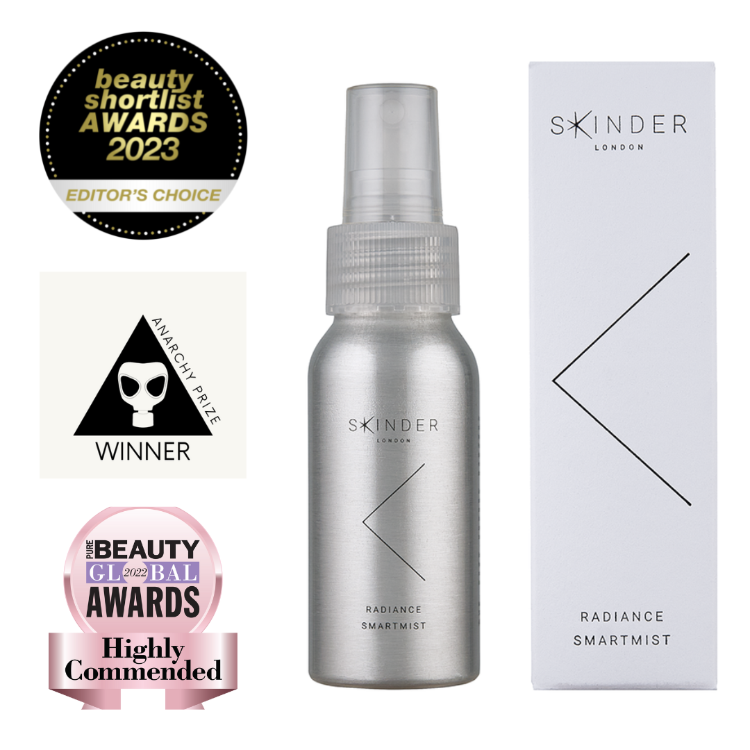 a photo of the SKINDER Radiance Smartmist skincare product with the logos of three awards it have won